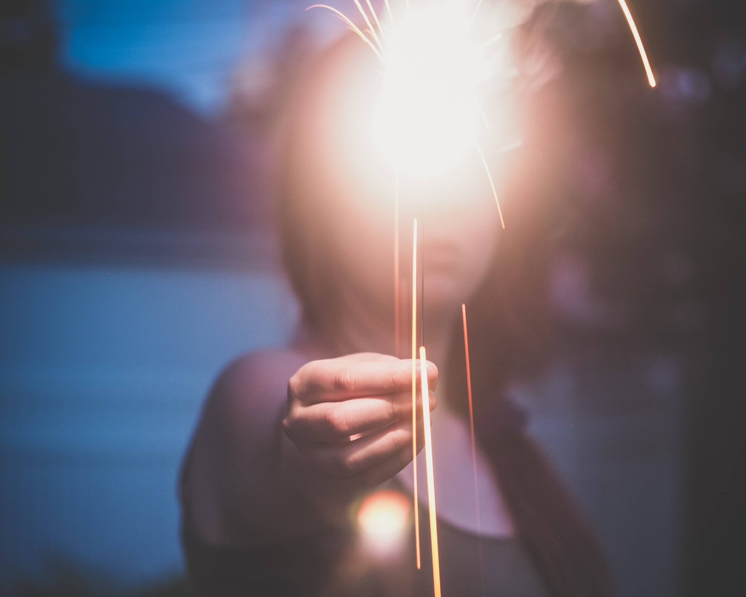 Human holding bulb